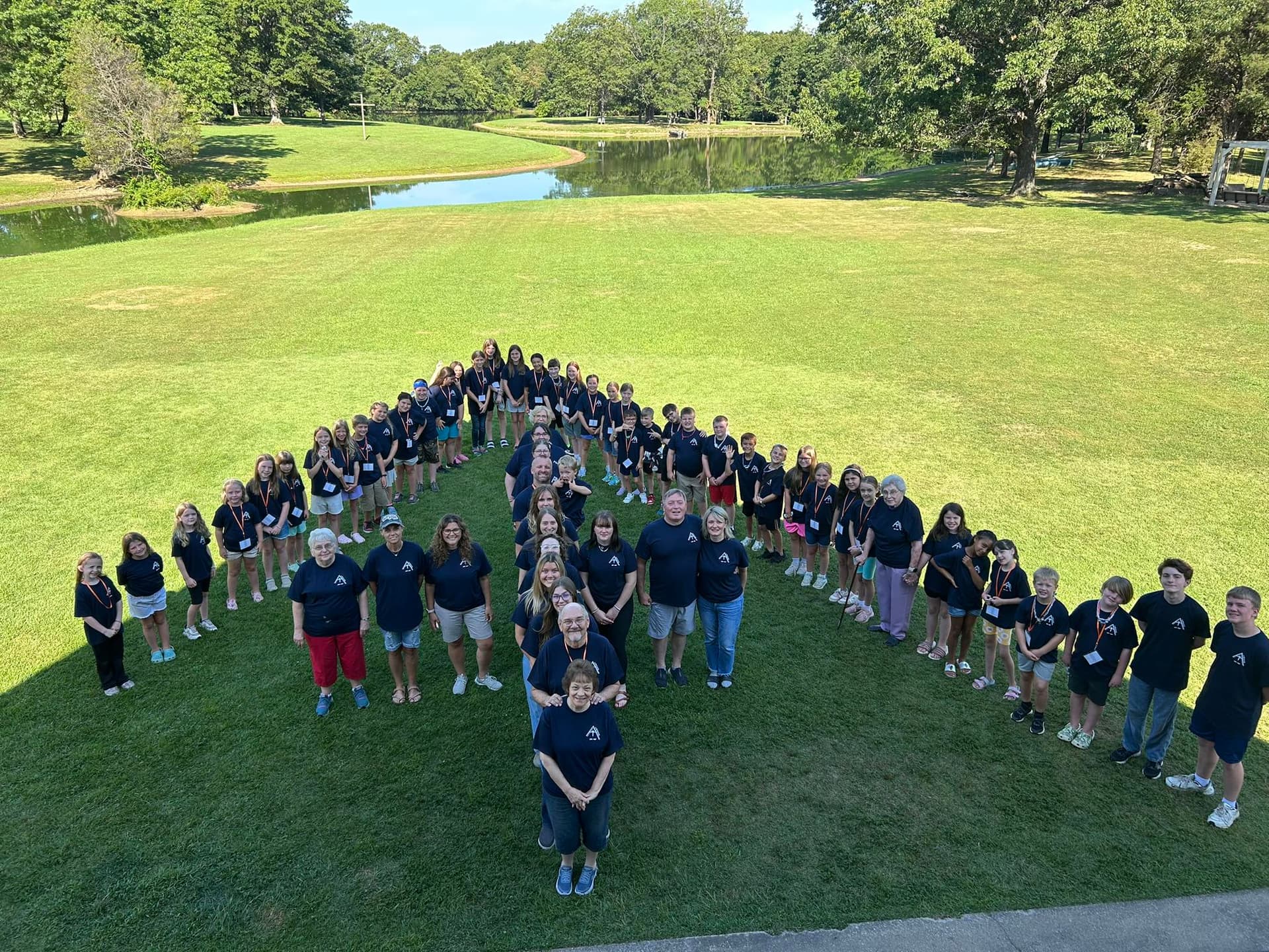 Junior Week 2025 campers in heart formation